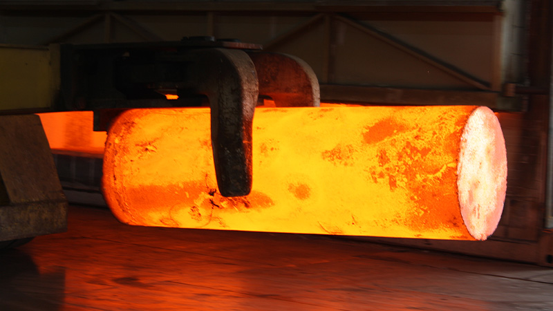 Glowing hot forged steel billet