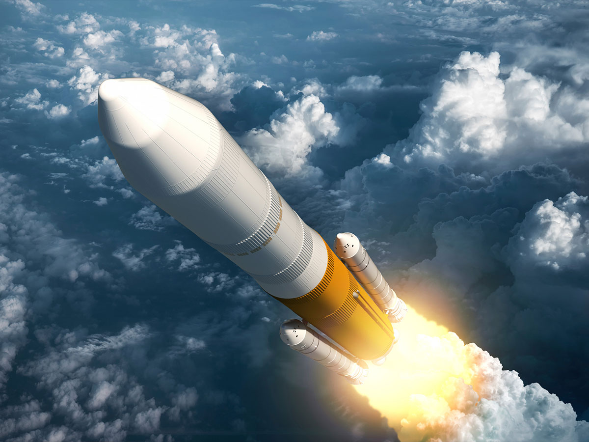 Rocket shooting through clouds